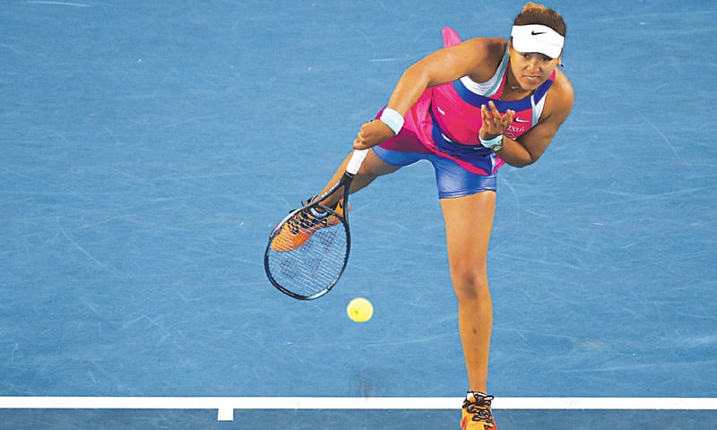 MELBOURNE: Japan’s Naomi Osaka serves to Amanda Anisimova of the US during their third-round match at the Australian Open on Friday.—AP