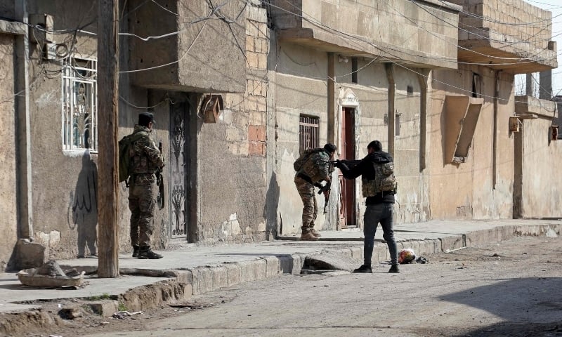 Kurdish security forces deploy in Syria's northern city of Hasakeh amid ongoing fighting for a third day with the Islamic State group on January 22. — AFP