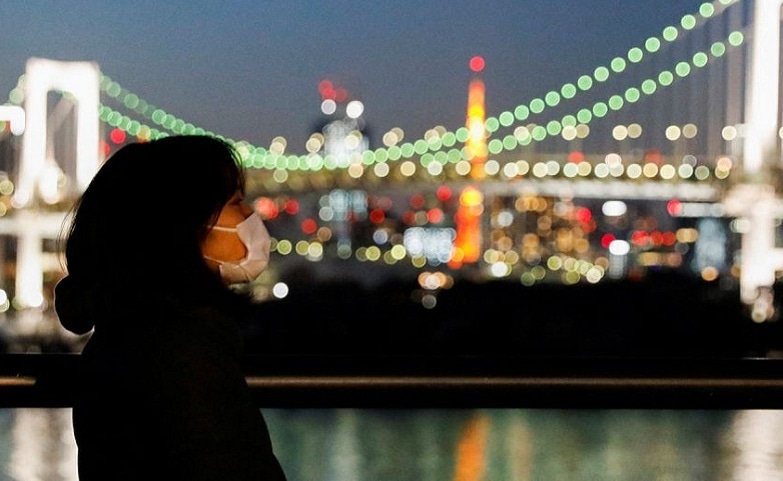 A visitor wearing a protective face mask strolls at the waterfront area of Odaiba Marine Park, amid the coronavirus disease pandemic, in Tokyo, Japan January 22, 2022.