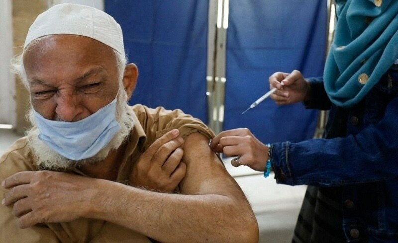 A man receives a dose of the coronavirus disease booster vaccine at a vaccination centre in Karachi on Jan 3, 2022. &mdash; Reuters
