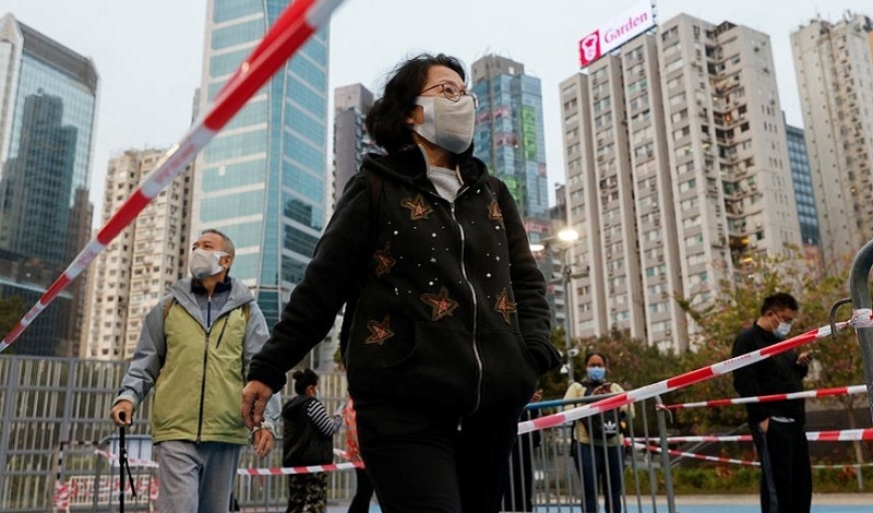 People queue up at a makeshift community testing centre for the coronavirus disease in Hong Kong on Jan 9, 2022. &mdash; Reuters/File