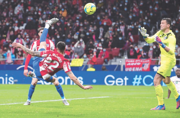 MADRID: Atletico Madrid’s Mario Hermoso shoots to score during the La Liga match against Getafe CF at the Wanda Metropolitano Stadium.—AFP