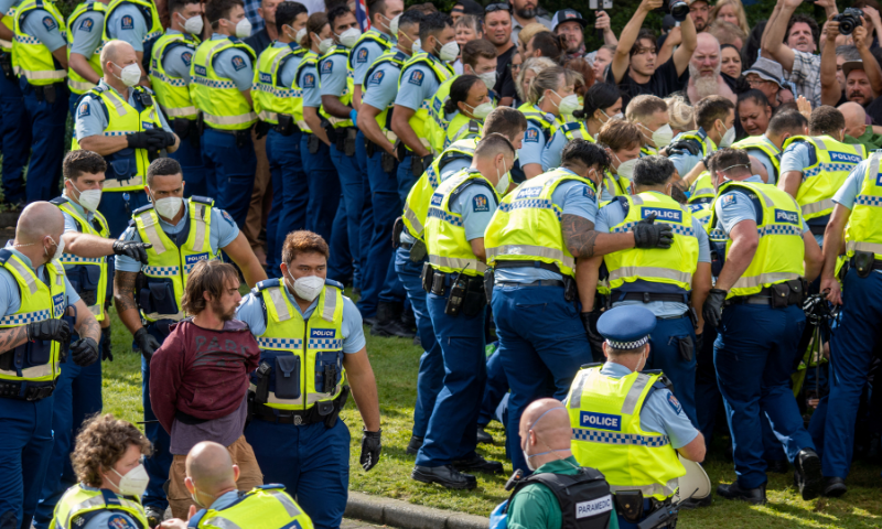 People clash with New Zealand police as they gather outside the Parliament building in protest against coronavirus vaccination mandates, in Wellington, New Zealand, in this Feb 10 file photo. — Reuters