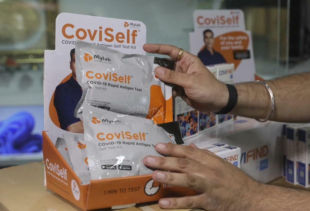 A wholesale vendor displays Rapid Antigen Test kits at his outlet in Hyderabad, India, Feb 16. &mdash; AP
