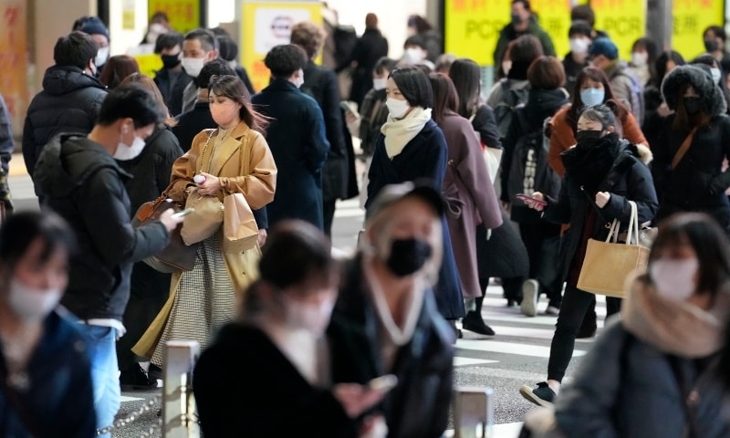 People crowd the street at Shinjuku area in Tokyo on Feb 17. &mdash; AP