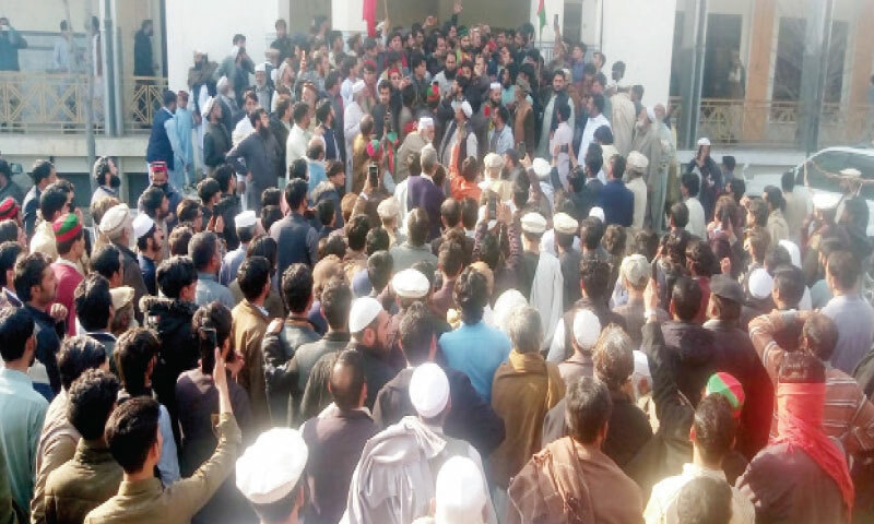 Candidates and their supporters gather outside the returning officer’s office in Lower Dir on Friday to submit nomination papers. — Dawn Candidates and their supporters gather outside the returning officer’s office in Lower Dir on Friday to submit nomination papers. — Dawn
