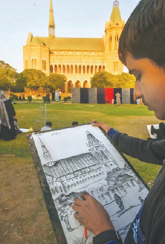 dancers entertain visitors, who came to attend the art workshop, while a student (right) draws the iconic Frere Hall building.&mdash;Fahim Siddiqi / White Star