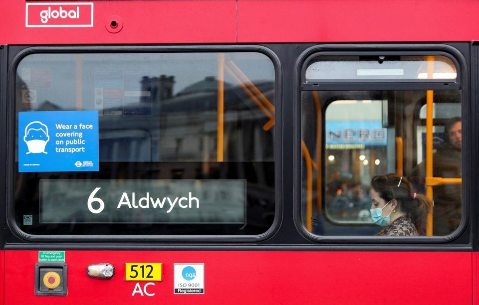 A coronavirus notice is seen in the window of a bus in London, Britain, February 20. &mdash; Reuters