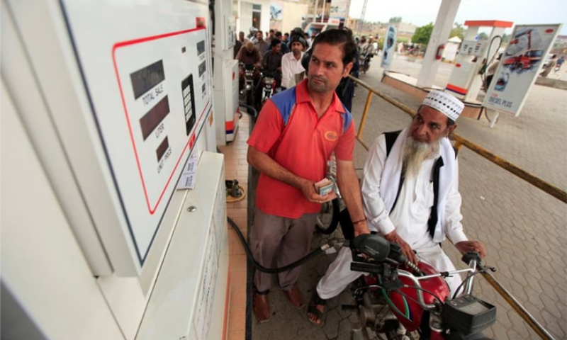 Motorcyclists wait in line at a fuel station in Rawalpindi in this file photo. — Reuters