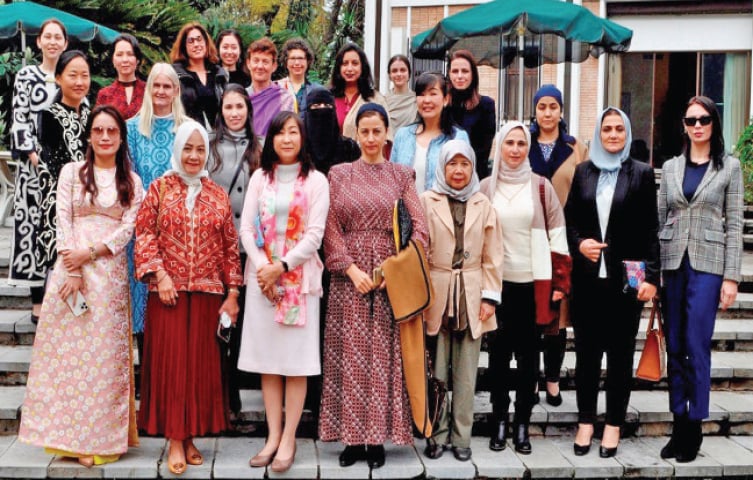 Naoko Wada, spouse of the Japanese ambassador, poses with guests from various diplomatic missions.