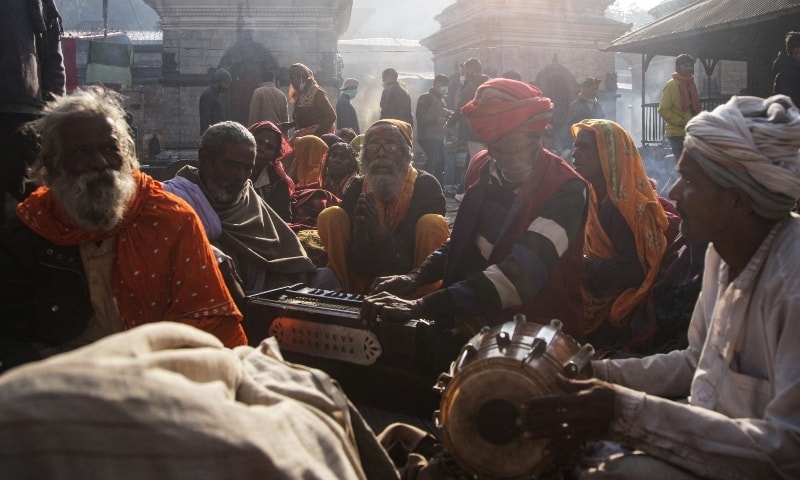 Hindu holy men sing religious songs as they gather at the premises of Pashupatinath Temple during the Shivaratri festival in Kathmandu on March 1. — Reuters