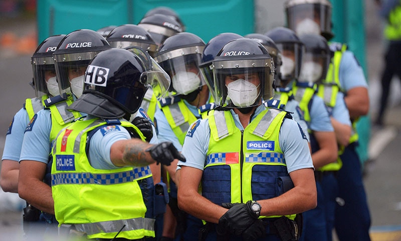 Police deploy as demonstrators against Covid-19 vaccine mandates and restrictions gather outside of the New Zealand Parliament grounds in Wellington on Wednesday. — AFP