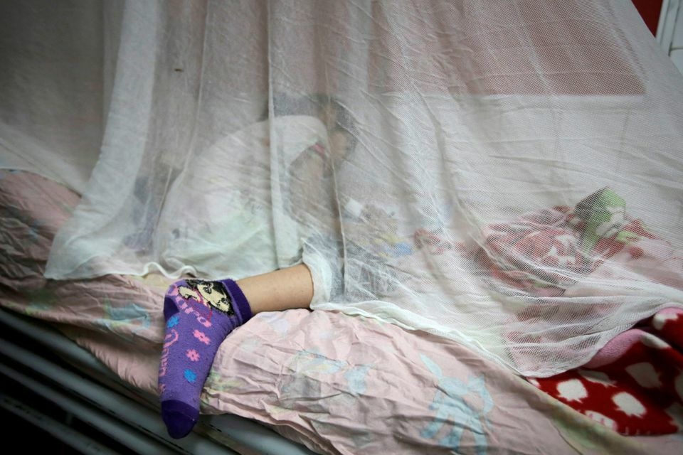 A girl with dengue fever receives attention at Hospital Escuela in Tegucigalpa, Honduras, July 29, 2019. &mdash; Reuters/File
