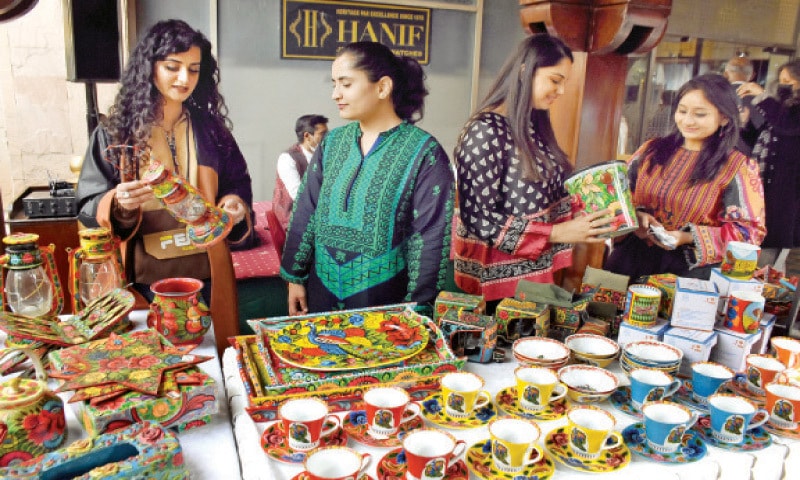 Women watch different kinds of stuff on a stall during &ldquo;Craft Festival&rdquo; in Islamabad on Saturday. &mdash; Online
