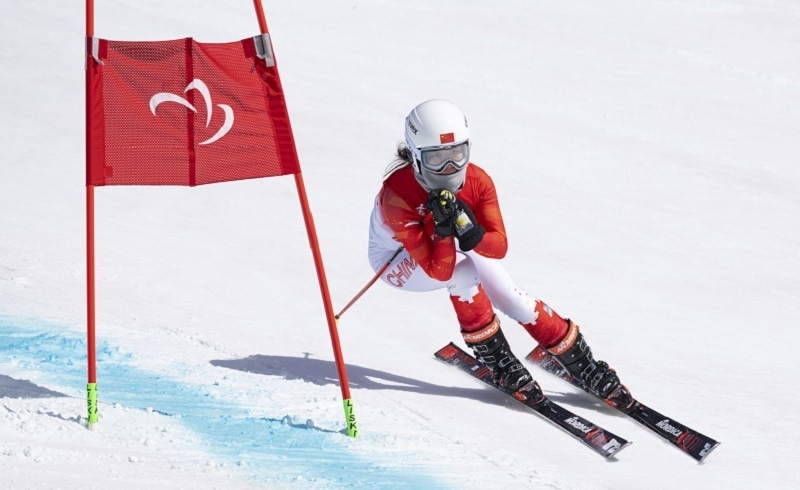 In this photo provided by Olympic Information Services, Mengqiu Zhang of China competes in the women's Super-G Standing Para Alpine Skiing at the Yanqing National Alpine Skiing Centre during the Beijing Winter Paralympic Games in Yanqing, China, on Sunday. — AP