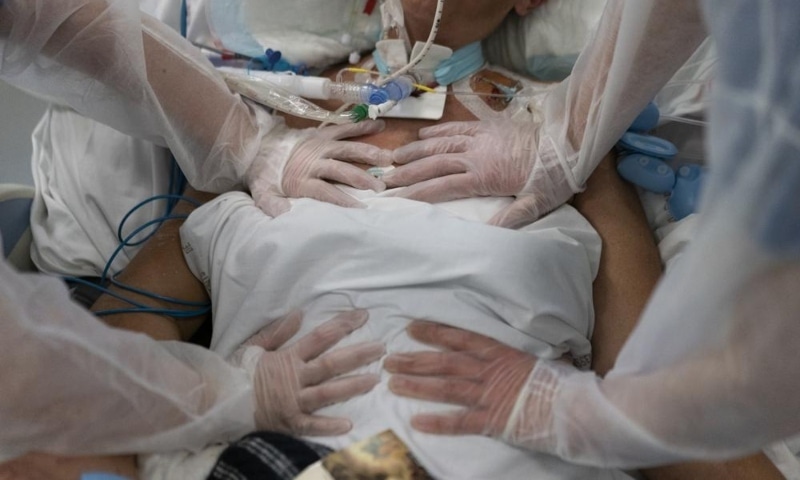 Nurses perform timed breathing exercises on a Covid-19 patient on a ventilator in the intensive care unit at the la Timone hospital in Marseille, southern France, on Dec 31, 2021. &mdash; AP