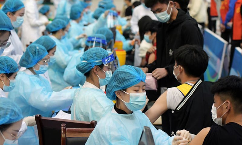 In this file photo, vedical workers inoculate students with the vaccine against the coronavirus at a university in Qingdao, Shandong province, China. — Reuters/File