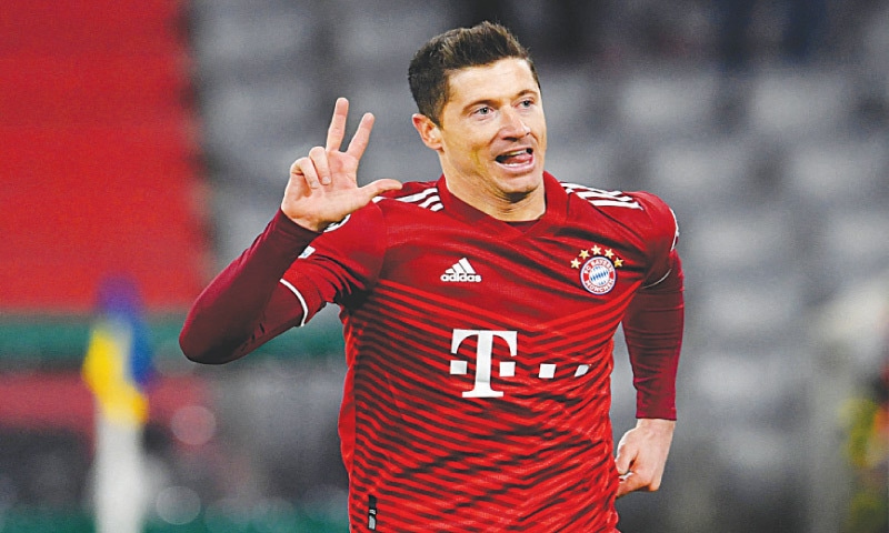 MUNICH: Bayern Munich&rsquo;s Robert Lewandowski celebrates after scoring during the round-of-16 second leg against RB Salzburg at the Allianz Arena.&mdash;Reuters