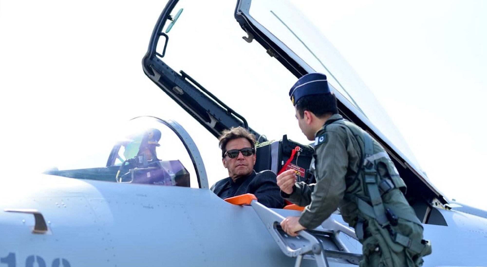 Prime Minister Imran Khan inspects the JC-10 aircraft and sits in the cockpit where he is given a briefing about the jet. — Picture courtesy: PMO