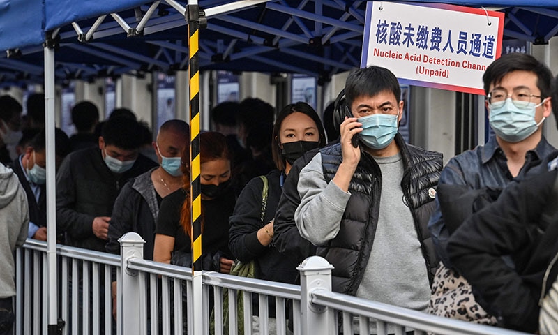People queue up to be tested as a measure against the coronavirus at the Shanghai Jin'an Central Hospital, in Shanghai on Friday. — AFP