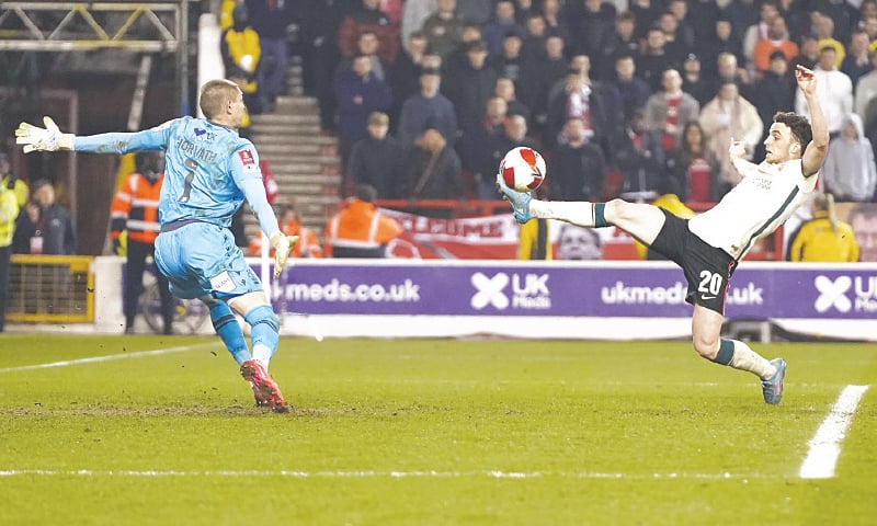 NOTTINGHAM: Liverpool’s Diogo Jota scores the winner during the FA Cup quarter-final against Nottingham Forest at the City Ground.—AP NOTTINGHAM: Liverpool’s Diogo Jota scores the winner during the FA Cup quarter-final against Nottingham Forest at the City Ground.—AP