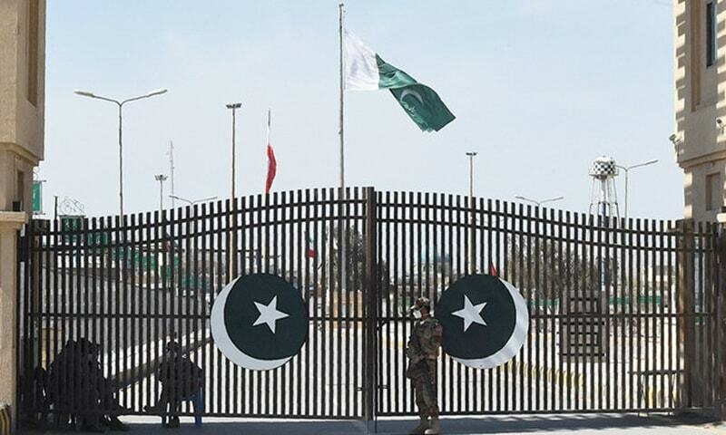 Soldiers wearing facemasks stand guard at the closed Pakistan-Iran border in Taftan in this Feb 2020 file photo. — AFP/File