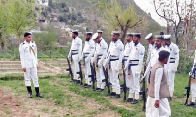 A navy contingent gets ready in Lower Dir on Wednesday to pay respects to a pilot martyred in Peshawar crash. &mdash; Dawn