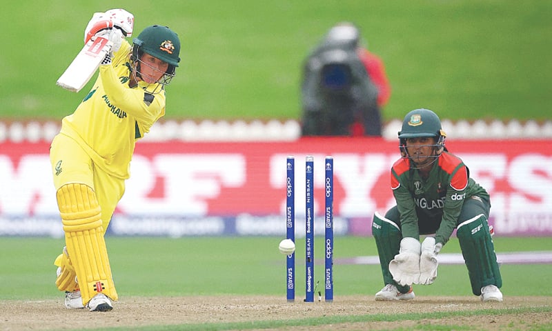 AUSTRALIAN batter Beth Mooney plays a shot as  Bangladesh wicket-keeper Nigar Sultana looks on during their Women&rsquo;s World Cup match on Friday.&mdash;AFP
