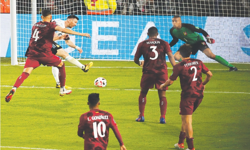 BUENOS AIRES: Argentina’s Lionel Messi (second L) shoots to score against Venezuela during their World Cup qualifier at the La Bombonera Stadium.—AFP BUENOS AIRES: Argentina’s Lionel Messi (second L) shoots to score against Venezuela during their World Cup qualifier at the La Bombonera Stadium.—AFP