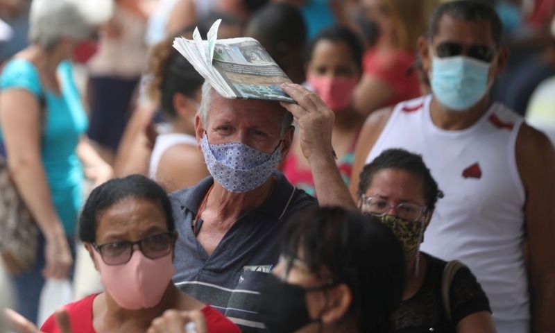 People line up to receive the first dose of Sinovac's CoronaVac coronavirus disease vaccine for senior citizens, in Duque de Caxias, Rio de Janeiro state, Brazil on March 5, 2021. &mdash; Reuters