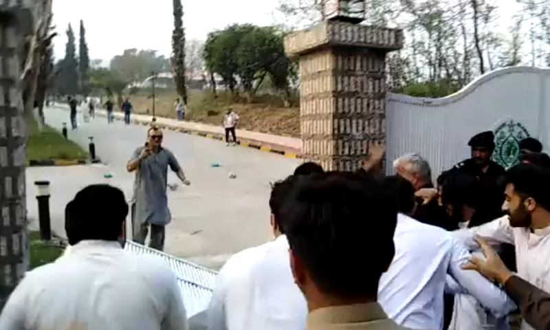 PTI supporters protest outside the Sindh House in Islamabad on March 18. — DawnNewsTV PTI supporters protest outside the Sindh House in Islamabad on March 18. — DawnNewsTV
