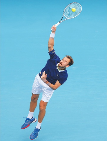 DANIIL Medvedev of Russia serves to Poland’s Hubert Hurkacz during their Miami Open quarter-final at the Hard Rock Stadium.—AFP