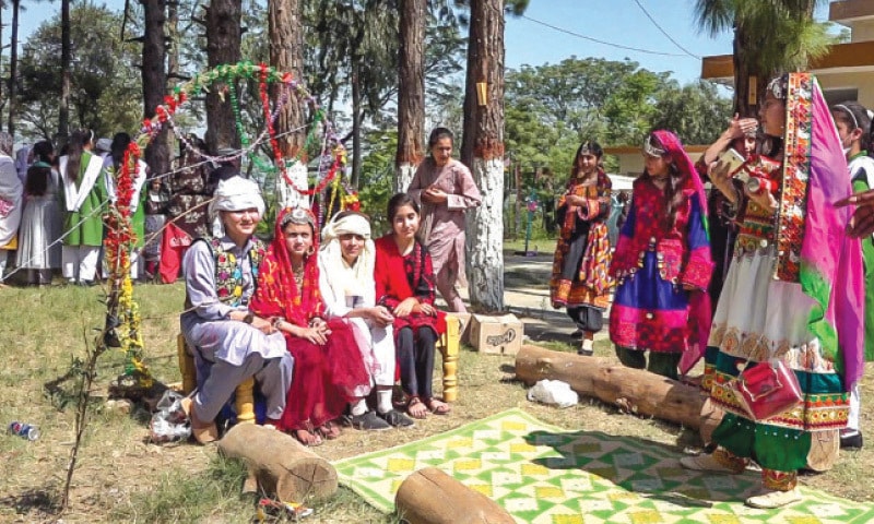 Students wearing traditional dresses at the colourful cultural event. &mdash; Dawn