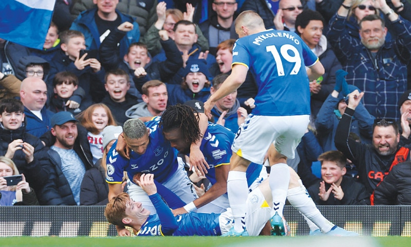 LIVERPOOL: Everton’s Anthony Gordon (bottom) celebrates with team-mates after scoring during the Premier League match against Manchester United at Goodison Park on Saturday.—Reuters LIVERPOOL: Everton’s Anthony Gordon (bottom) celebrates with team-mates after scoring during the Premier League match against Manchester United at Goodison Park on Saturday.—Reuters