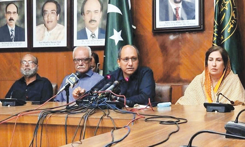Sindh Information Minister Saeed Ghani and other PPP leaders address a press conference on Tuesday.—PPI Sindh Information Minister Saeed Ghani and other PPP leaders address a press conference on Tuesday.—PPI