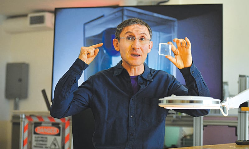 BIONAUT Labs founder Michael Shpigelmacher shows a tiny remote-controlled medical micro-robot which his company is developing as a new method for medical treatment.—AFP BIONAUT Labs founder Michael Shpigelmacher shows a tiny remote-controlled medical micro-robot which his company is developing as a new method for medical treatment.—AFP
