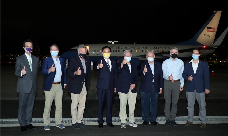 Bob Menendez, chairman of the US Senate Foreign Relations Committee, and other members of the US delegation pose for a family photo with Taiwan Foreign Minister Joseph Wu as they arrive at Taipei Songshan airport in Taipei, Taiwan. — Reuters