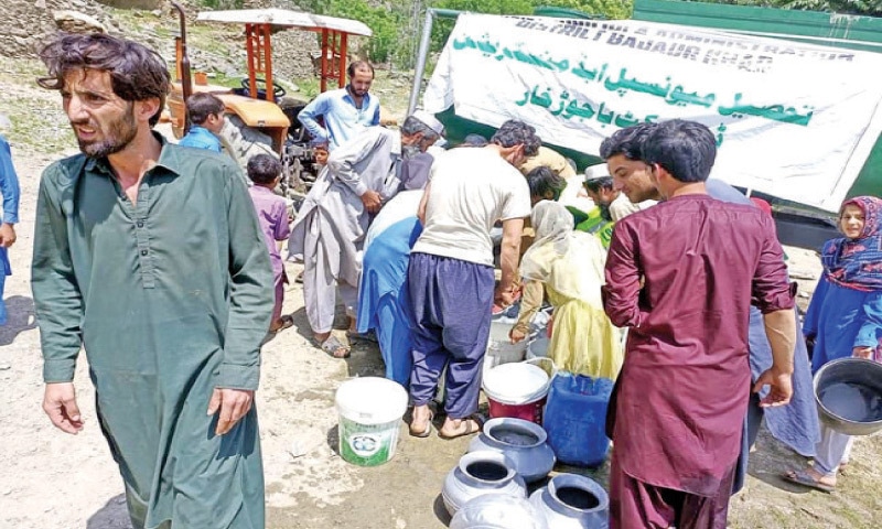 The residents of Utmankhel area in Bajaur getting water from a tanker of tehsil municipal administration on Saturday. — Dawn The residents of Utmankhel area in Bajaur getting water from a tanker of tehsil municipal administration on Saturday. — Dawn