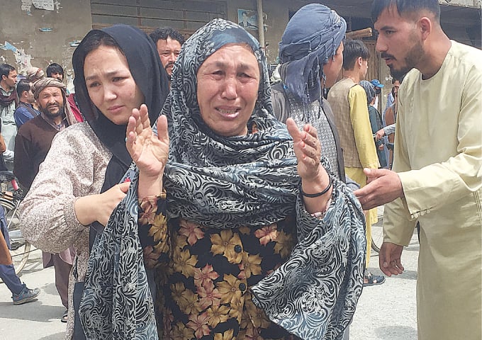 KABUL: An Afghan woman becomes frantic in the search for her loved ones after an explosion rocked a high school in a predominantly-Hazara area of the Afghan capital on Tuesday.&mdash;Reuters
