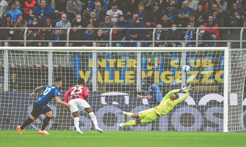 MILAN: Inter Milan&rsquo;s Lautaro Martinez (L) scores past AC Milan goalkeeper Mike Maignan during the Coppa Italia semi-final second leg at San Siro.&mdash;AFP