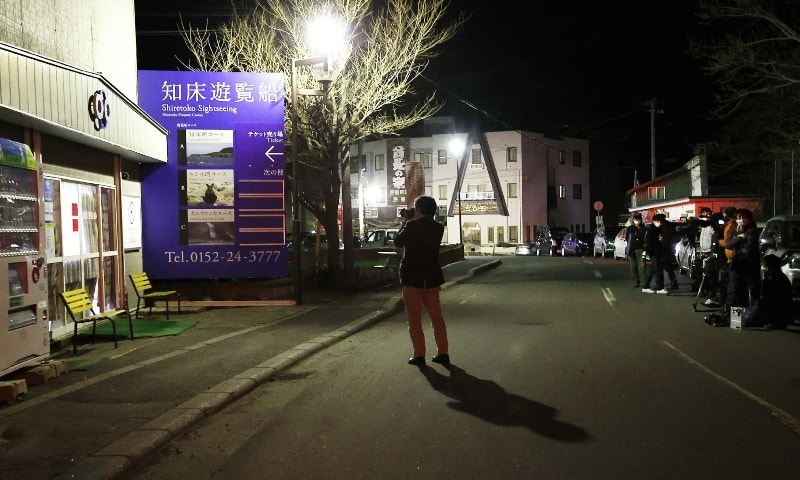 Reporters gather in front of Shiretoko Sightseeing, a tour company building, which a tour boat with 26 people onboard is missing, in Shari, Hokkaido on April 23. — AFP Reporters gather in front of Shiretoko Sightseeing, a tour company building, which a tour boat with 26 people onboard is missing, in Shari, Hokkaido on April 23. — AFP