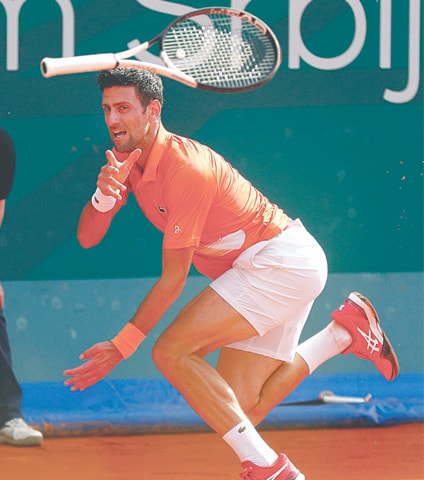 BELGRADE: Serbia’s Novak Djokovic loses his racket during the Serbia Open final against Andrey Rublev of Russia.—AFP BELGRADE: Serbia’s Novak Djokovic loses his racket during the Serbia Open final against Andrey Rublev of Russia.—AFP