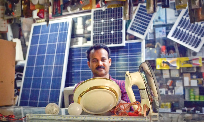 A shopkeeper in  Saddar’s Regal Market proudly displays monocrystalline and polysilicone solar panels | Fahim Siddiqui/White Star