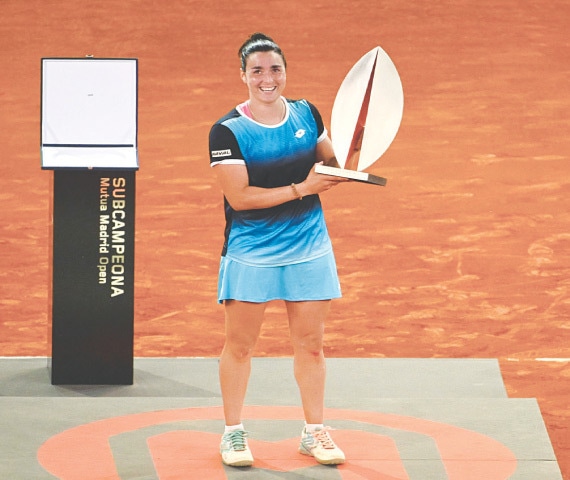 MADRID: Tunisia’s Ons Jabeur celebrates with the trophy after winning the Madrid Open final against Jessica Pegula of the US.—AFP