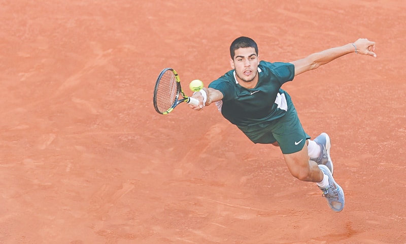 MADRID: Spain&rsquo;s Carlos Alcaraz stretches for a return to Alexander Zverev of Germany during the Madrid Open final at the Caja Magica.&mdash;AFP