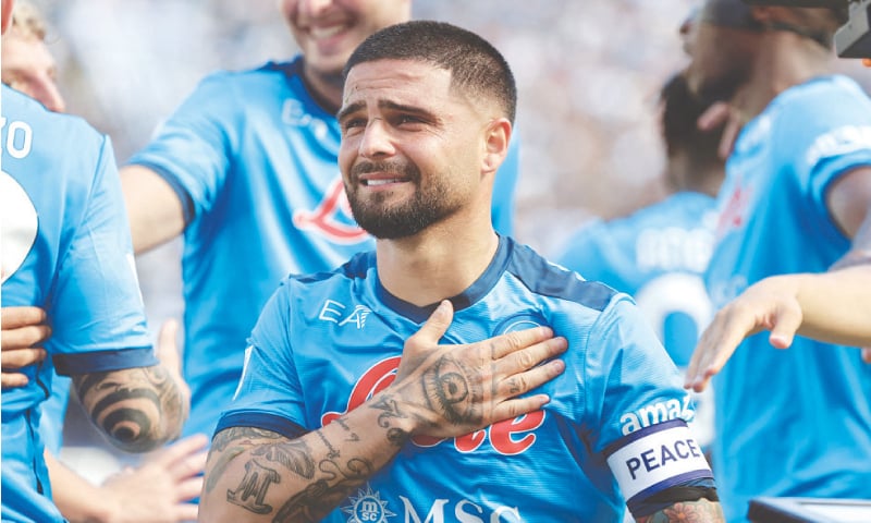 NAPLES: Napoli’s Lorenzo Insigne celebrates with team-mates after scoring during the Serie A match against Genoa at the Stadio Diego Armando Maradona.—Reuters