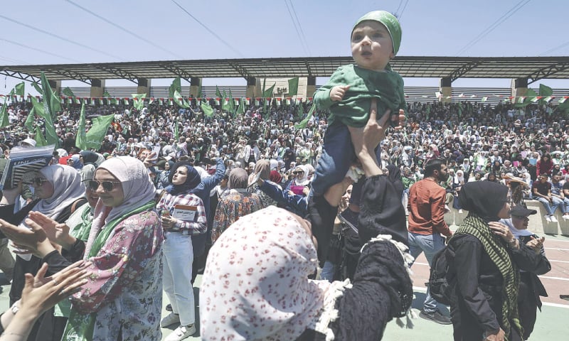 Palestinian students celebrate the victory of Hamas in student union elections at Birzeit University, in Israeli-occupied West Bank, on Thursday.—AFP