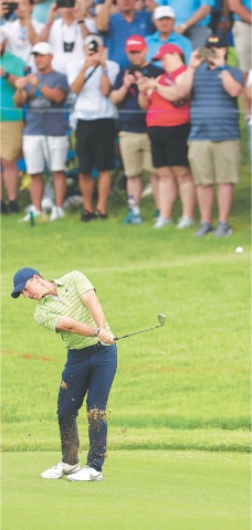 RORY McIlroy of Northern Ireland plays the second shot on the tenth hole during the first round of the PGA Championship on Thursday.—AFP