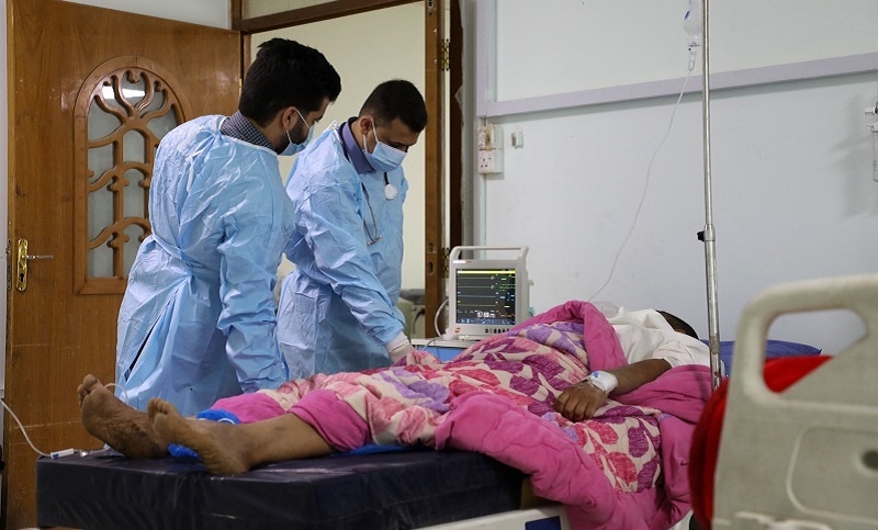 Doctors at a hospital in Iraq's southern Dhi Qar province, examine a patient infected with the tick-borne virus Crimean-Congo haemorrhagic illness, on May 25, 2022, during the country's worst detected outbreak of the illness. — AFP Doctors at a hospital in Iraq's southern Dhi Qar province, examine a patient infected with the tick-borne virus Crimean-Congo haemorrhagic illness, on May 25, 2022, during the country's worst detected outbreak of the illness. — AFP