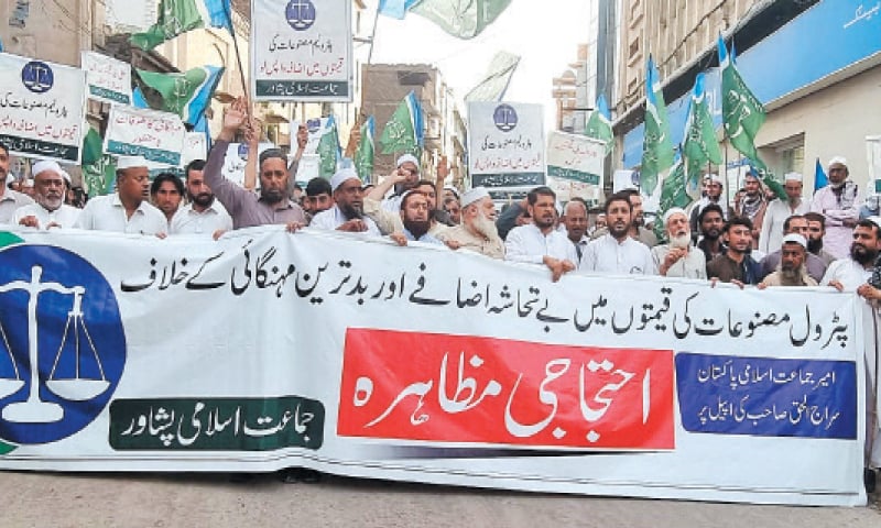 JI workers stage a protest on Masjid Mahabat Khan Road, Peshawar, on Sunday against the recent increase in prices of petroleum products. — White Star